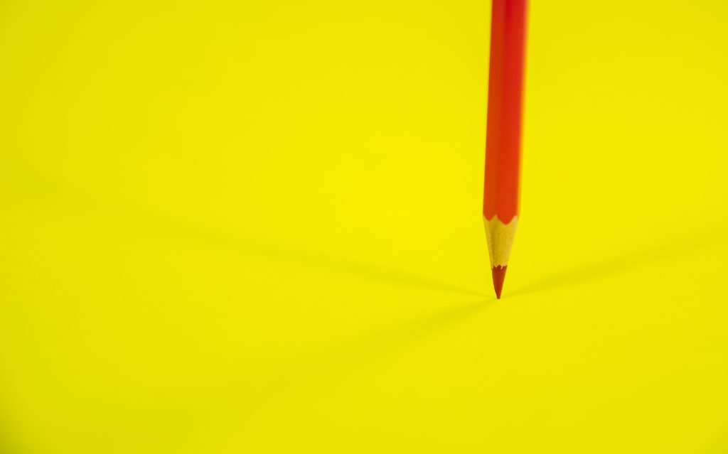 Header image: red pencil on a yellow background 