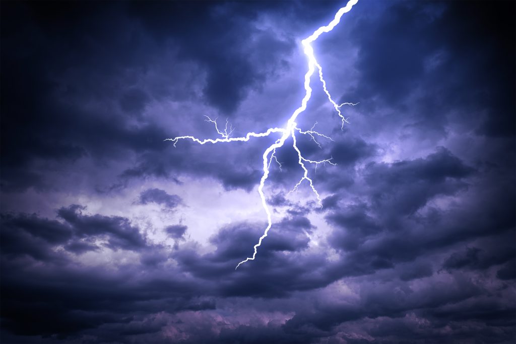 Header image: dark, stormy sky with lightning flash (credit: Den Rozhnovsky / Shutterstock.com)
